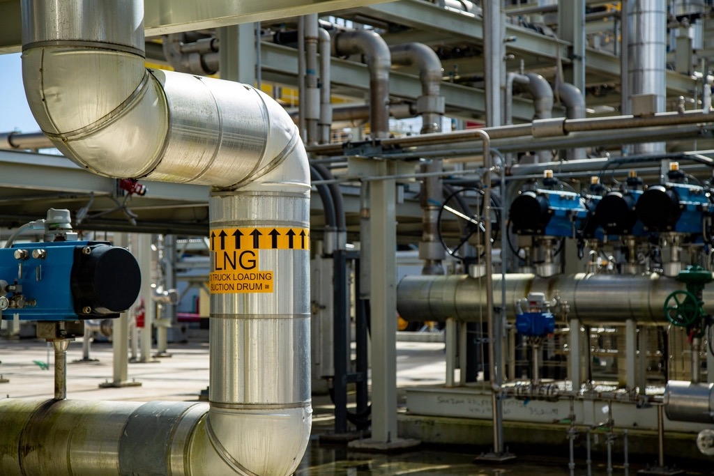 Stainless process pipework and valves running through a plant